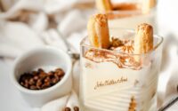 Photo of a Glass with Tiramisu and a Small Bowl of Coffee Beans