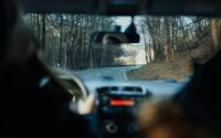 A person driving a car on a road